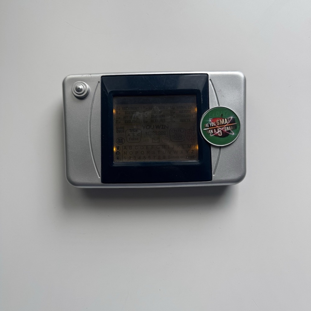 2007 Are You Smarter Than a 5th Grader Illuminated Electronic Handheld LCD Game